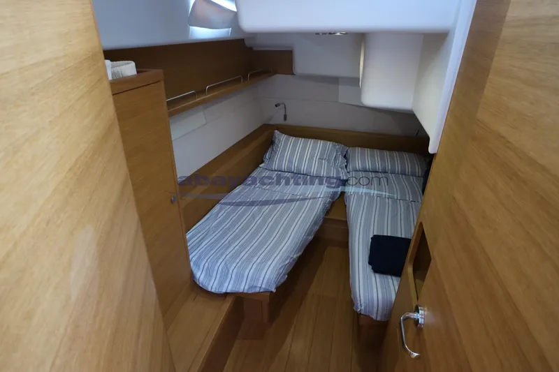  Yacht Photos Pics Cabin interior of 2016 Grand Soleil 46 LC yacht with twin beds and wooden finish.