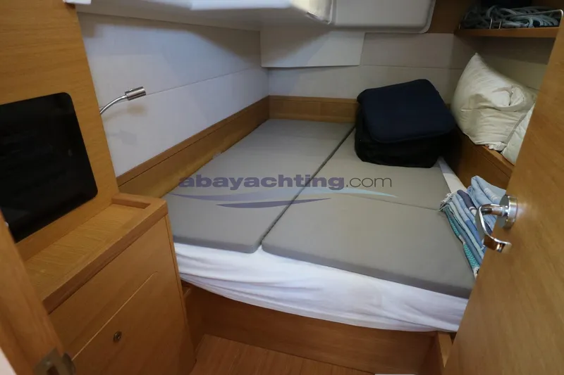 Yacht Photos Pics Cozy cabin interior of 2016 Grand Soleil 46 LC yacht with comfortable bedding.
