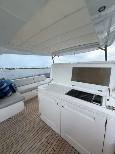 4 Play Yacht Photos Pics Sunseeker Manhattan 68 yacht deck with seating and grill, 2022 model.