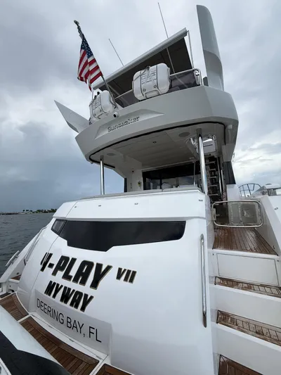 4 Play Yacht Photos Pics 2022 Sunseeker Manhattan 68 yacht with American flag, docked at Deering Bay, FL.