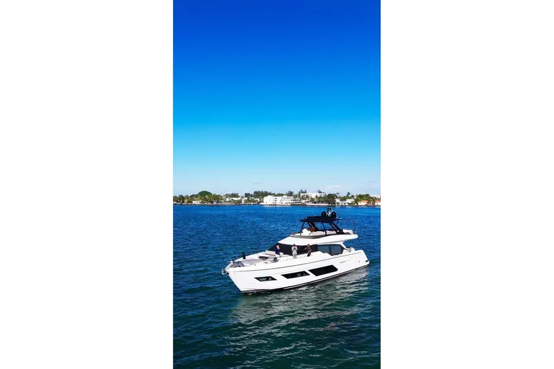  Yacht Photos Pics 2023 Ferretti Yachts 720 cruising on blue ocean under clear sky.