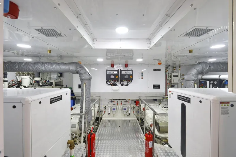 Tortura Yacht Photos Pics Engine room of 2025 Aegean Yacht Aegean Explorer, featuring modern equipment and fire extinguishers.
