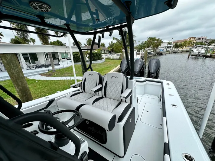  Yacht Photos Pics 2024 Yellowfin 36 boat interior with dual seats and steering console.