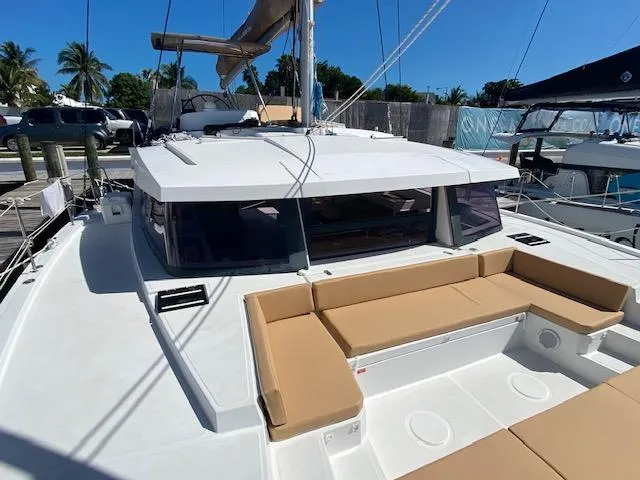  Yacht Photos Pics 2017 Bali 4.0 catamaran with spacious deck and seating area docked at marina.