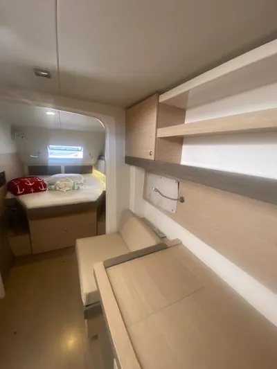  Yacht Photos Pics Interior cabin of a 2017 Bali 4.0 catamaran with bed and storage shelves.