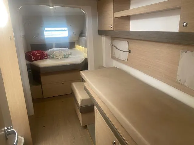  Yacht Photos Pics Interior cabin of a 2017 Bali 4.0 catamaran with bed and storage.