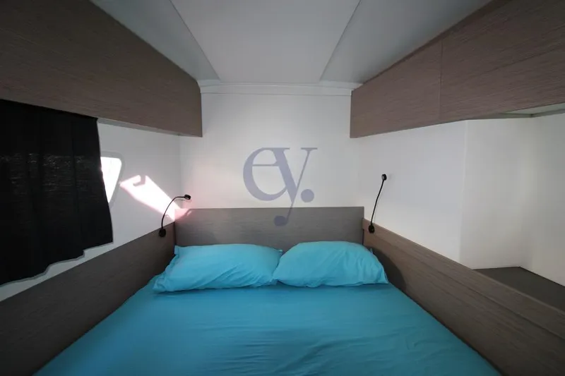  Yacht Photos Pics Interior cabin of 2021 Fountaine Pajot Astrea 42 with blue bedding.