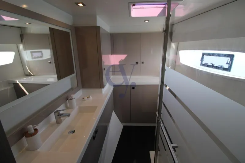  Yacht Photos Pics Luxurious bathroom interior of 2021 Fountaine Pajot Astrea 42 yacht, featuring modern fixtures.
