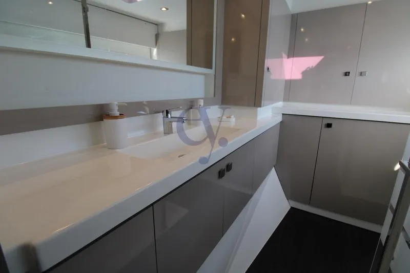  Yacht Photos Pics Modern bathroom interior on 2021 Fountaine Pajot Astrea 42 yacht, featuring sleek cabinetry.