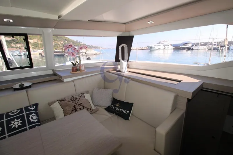  Yacht Photos Pics Interior of 2021 Fountaine Pajot Astrea 42 yacht with marina view.