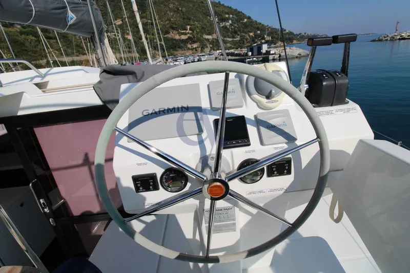  Yacht Photos Pics Helm of 2021 Fountaine Pajot Astrea 42 catamaran with Garmin navigation system.