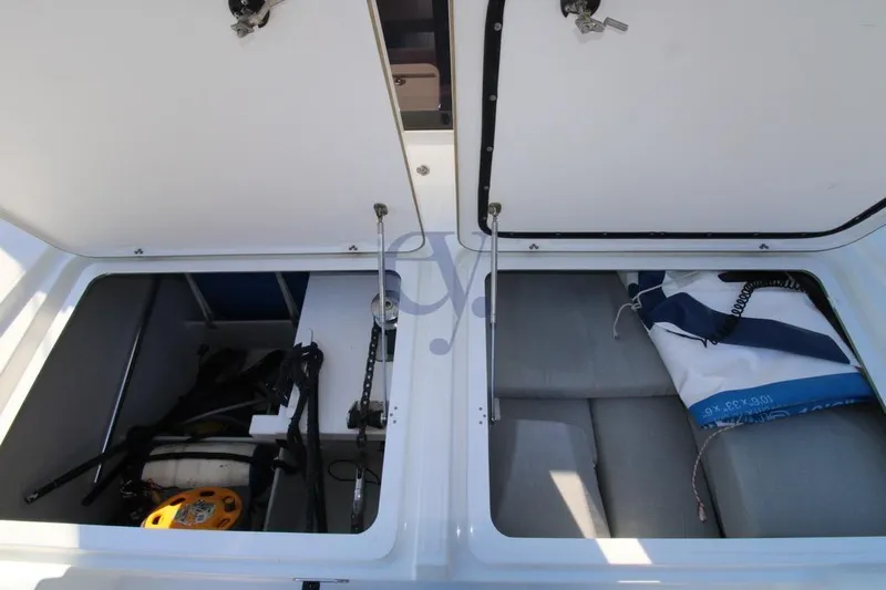  Yacht Photos Pics Open storage compartments on a 2021 Fountaine Pajot Astrea 42 catamaran.