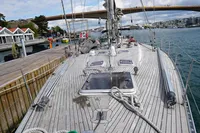 Sailboat deck view of 1989 Custom Scandinavian Cruiser Eagle docked at marina.