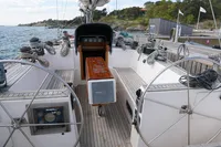 Cockpit of 1989 Custom Scandinavian Cruiser Eagle sailboat with dual steering wheels and wooden deck.