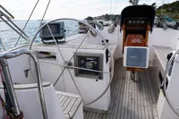 Cockpit of 1989 Scandinavian Cruiser Eagle sailboat with steering wheel and navigation equipment.