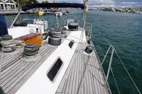 Sailboat deck of 1989 Scandinavian Cruiser Eagle, docked in a marina.