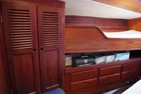 Interior of 1989 Custom Scandinavian Cruiser Eagle with wooden cabinets and storage drawers.