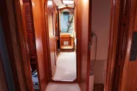 Interior of 1989 Scandinavian Cruiser Eagle with wooden paneling and narrow hallway.