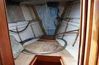 Interior of 1989 Custom Scandinavian Cruiser Eagle sailboat, showing cabin space and wooden elements.
