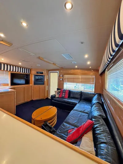  Yacht Photos Pics Interior of a 1999 Bertram 60 Convertible yacht with leather seating and modern amenities.