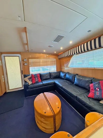  Yacht Photos Pics Interior of 1999 Bertram 60 Convertible yacht with leather seating and nautical decor.