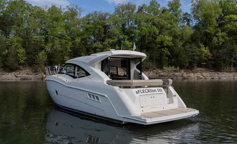 Aflecktion III Yacht Photos Pics 2014 Carver C37 yacht on calm water with forested shoreline background.