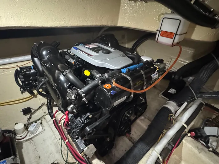 Aflecktion III Yacht Photos Pics Engine compartment of a 2014 Carver C37 boat, showcasing detailed mechanical components.