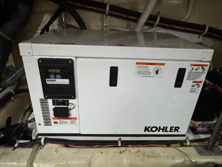 Aflecktion III Yacht Photos Pics Kohler generator in a 2014 Carver C37 boat engine room.