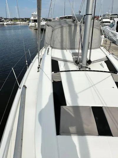Chasing Summer Yacht Photos Pics 2022 Beneteau Oceanis 46.1 sailboat deck view at marina.