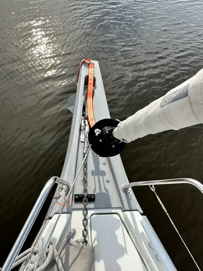 Chasing Summer Yacht Photos Pics Bow of 2022 Beneteau Oceanis 46.1 sailboat with anchor chain and calm water.