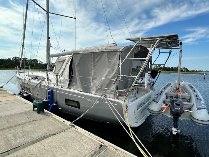 Chasing Summer Yacht Photos Pics 2022 Beneteau Oceanis 46.1 yacht docked with inflatable boat attached.