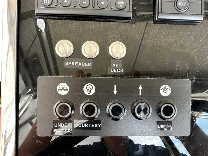 Chasing Summer Yacht Photos Pics Control panel of a 2022 Beneteau Oceanis 46.1 yacht with labeled buttons.