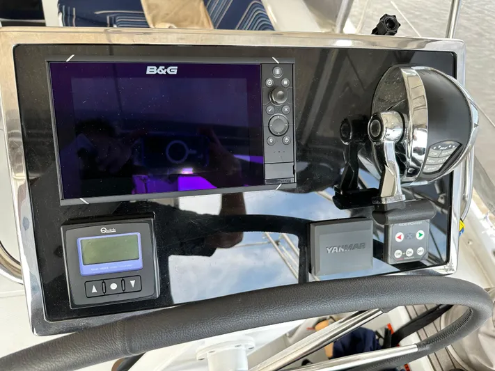 Chasing Summer Yacht Photos Pics Control panel of a 2022 Beneteau Oceanis 46.1 yacht with navigation and throttle controls.
