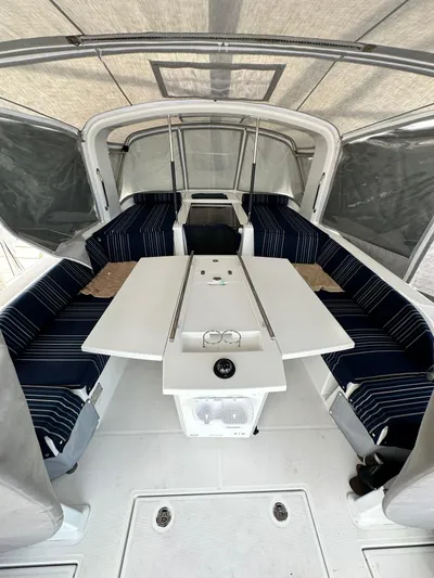 Chasing Summer Yacht Photos Pics Interior of 2022 Beneteau Oceanis 46.1 yacht with seating and table setup.