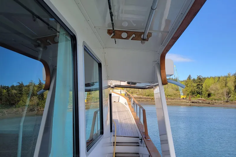 Shackleton Yacht Photos Pics 1982 Miller Marine North Sea Trawler Ed Monk, docked with scenic water and forest view.