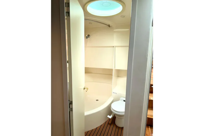 Lunasea Yacht Photos Pics Bathroom interior of 1996 Carver 500 Cockpit Motor Yacht with shower and toilet.