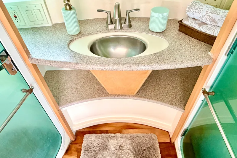 Lunasea Yacht Photos Pics Bathroom sink area in a 1996 Carver 500 Cockpit Motor Yacht, featuring modern fixtures.