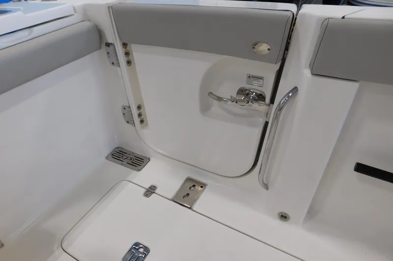 Three Point O.h. Yacht Photos Pics 2022 Pursuit S 328 Sport boat interior with sleek white and gray design.