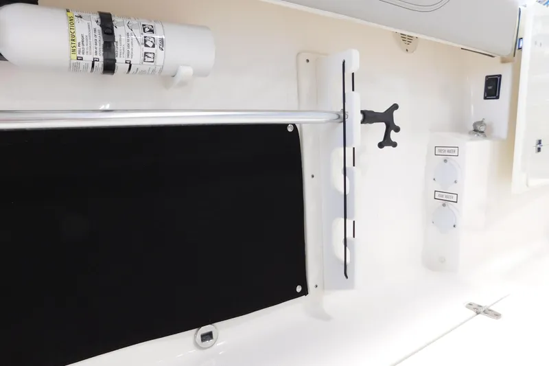 Three Point O.h. Yacht Photos Pics 2022 Pursuit S 328 Sport boat interior with fire extinguisher and water controls.