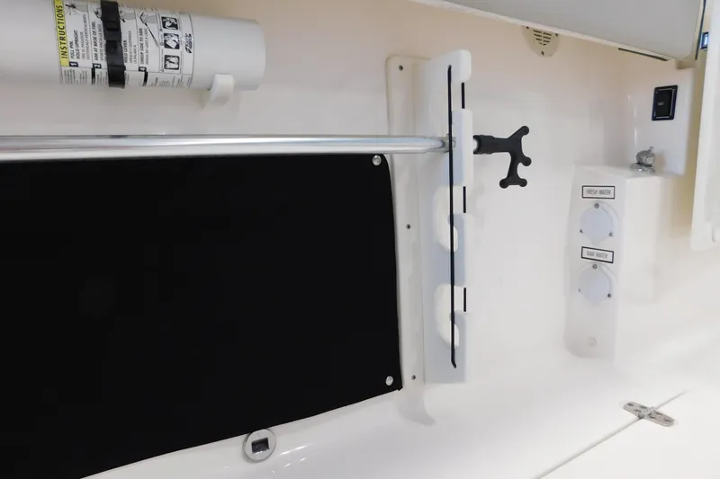 Three Point O.h. Yacht Photos Pics 2022 Pursuit S 328 Sport boat interior with utility panel and water controls.