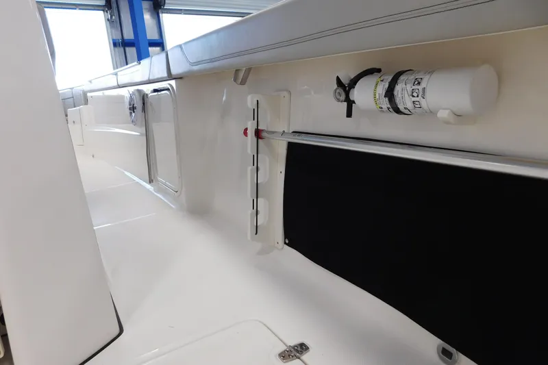 Three Point O.h. Yacht Photos Pics 2022 Pursuit S 328 Sport boat interior with safety equipment and sleek design.