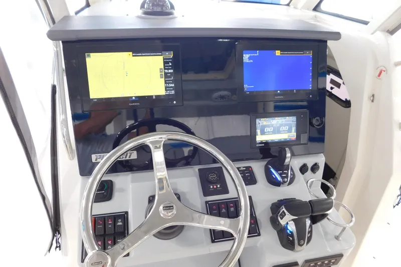 Three Point O.h. Yacht Photos Pics 2022 Pursuit S 328 Sport boat dashboard with advanced navigation and control systems.