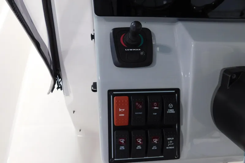 Three Point O.h. Yacht Photos Pics Control panel of 2022 Pursuit S 328 Sport boat with joystick and switches.