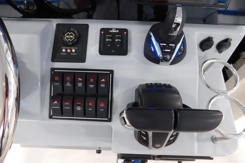 Three Point O.h. Yacht Photos Pics Control panel of 2022 Pursuit S 328 Sport boat with switches and throttle.