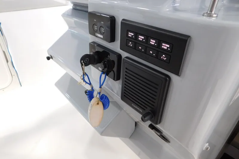 Three Point O.h. Yacht Photos Pics Control panel of 2022 Pursuit S 328 Sport boat with Yamaha and Garmin systems.