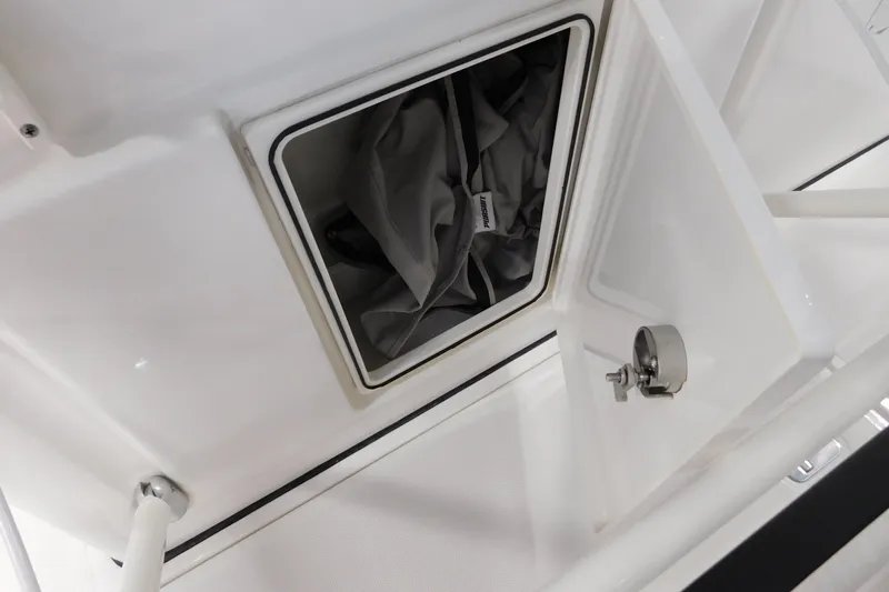 Three Point O.h. Yacht Photos Pics 2022 Pursuit S 328 Sport boat storage compartment with open hatch and lock.