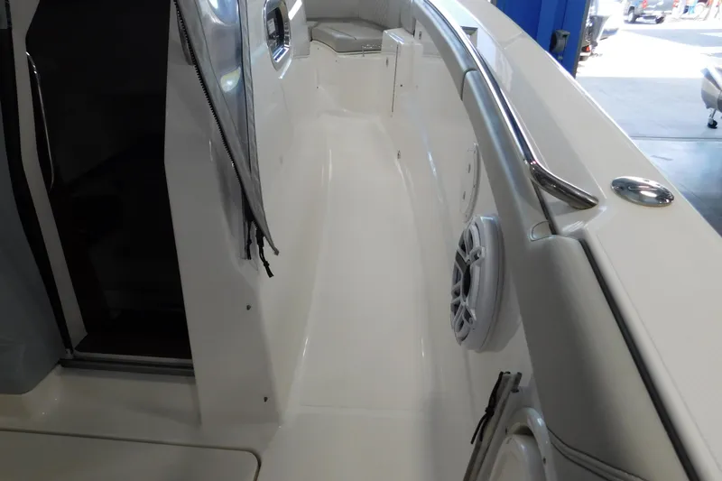Three Point O.h. Yacht Photos Pics 2022 Pursuit S 328 Sport boat interior with sleek white deck and stainless steel railing.