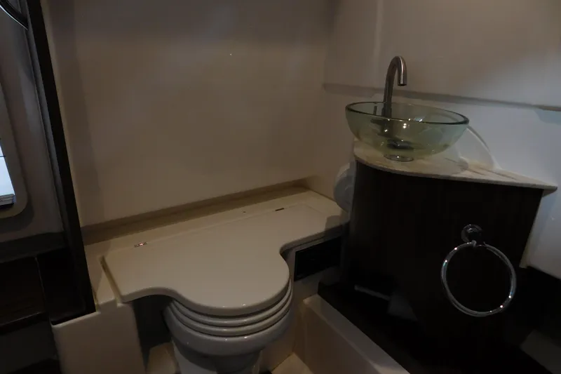 Three Point O.h. Yacht Photos Pics 2022 Pursuit S 328 Sport boat bathroom with modern sink and toilet.