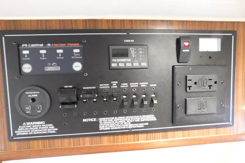 Three Point O.h. Yacht Photos Pics Control panel of 2022 Pursuit S 328 Sport boat with various switches and indicators.