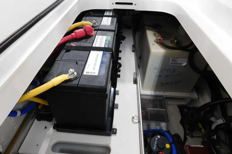 Three Point O.h. Yacht Photos Pics Battery compartment of 2022 Pursuit S 328 Sport boat, featuring dual batteries and wiring.